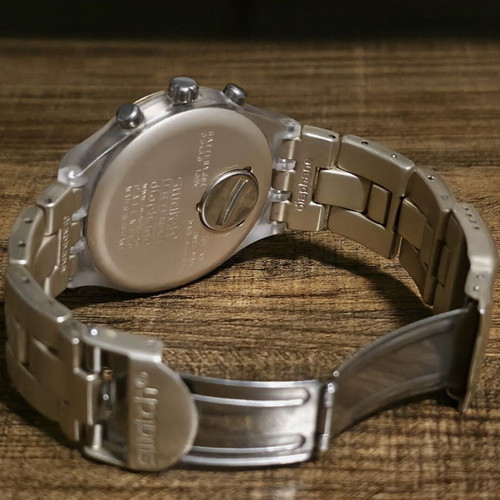 Swatch women's watch like new, gold and transparent color