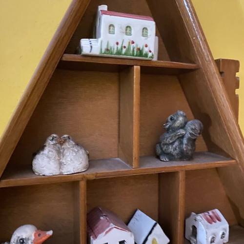 Decorative wall shelf with miniature collection case used
