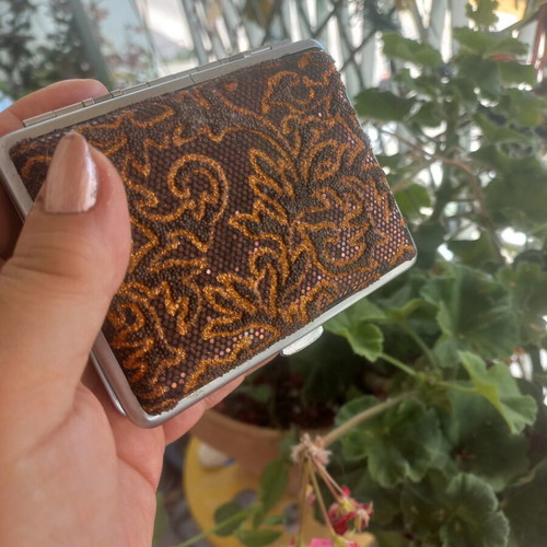 Status Collection metal cigarette case with embossed glitter design