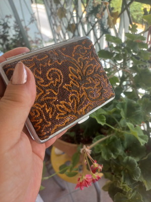 Status Collection metal cigarette case with embossed glitter design