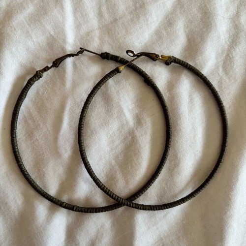Hoop earrings used with green fabric
