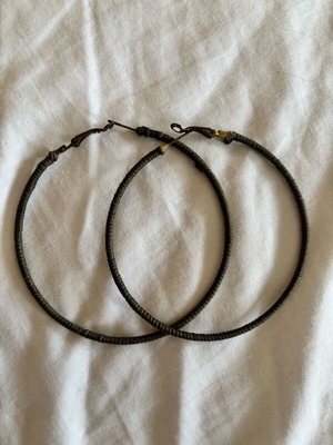 Hoop earrings used with green fabric