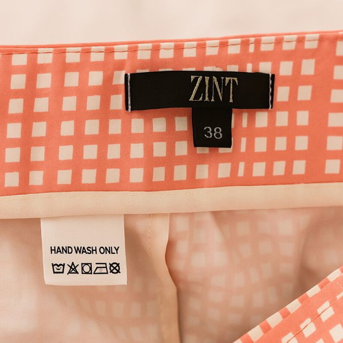 Zini pants size 38 like new coral with white geometric pattern