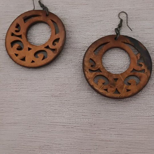 Wooden earrings used with carved design, brown