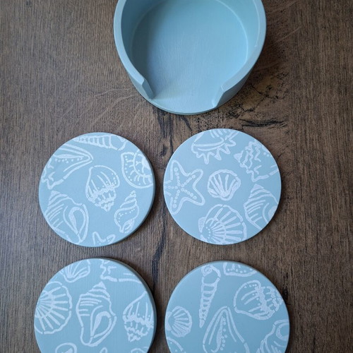 Handmade plaster coaster set with summer decoration and soft blue color