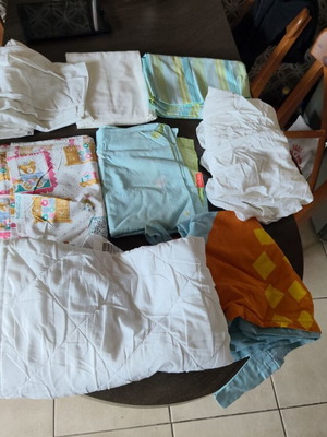 Baby trousseau like new with sheets, quilt, and curtain