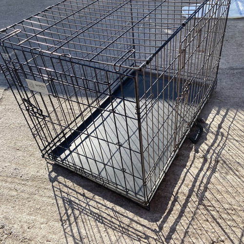 Dog crate used for a large dog with two doors and cleaning tray