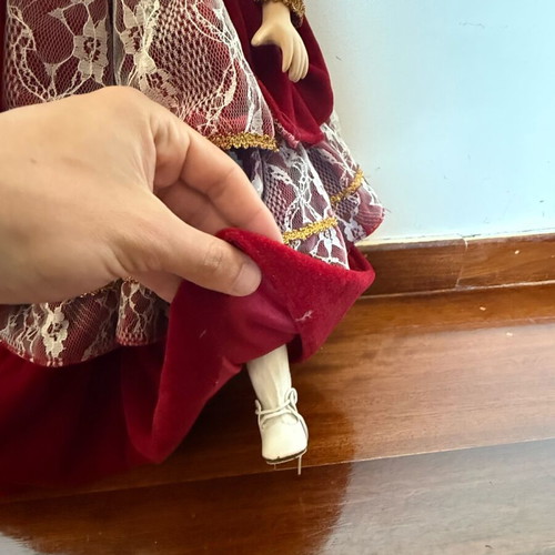 Porcelain doll with burgundy velvet dress like new
