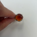 Monopetro ring with brown-red stone used