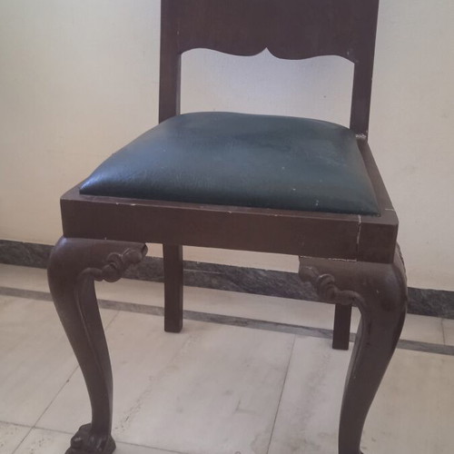 Antique chair used with lion's paw legs needing repair