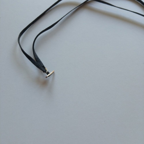 Silver cross with cord like new