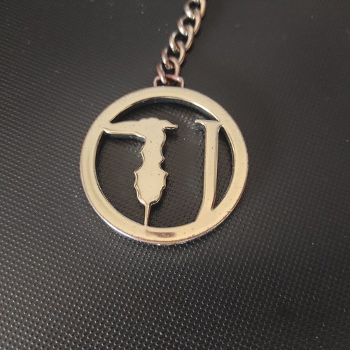 Trussardi bag charm new, silver and gold tone