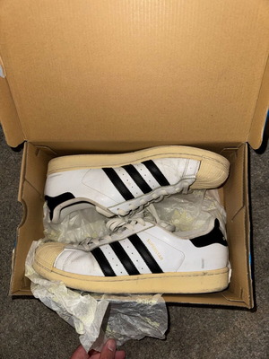 Adidas Superstar used white sneakers with black stripes, size 46
