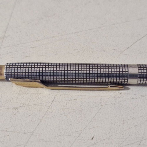 Parker pen in like new condition, possibly silver or silver-plated
