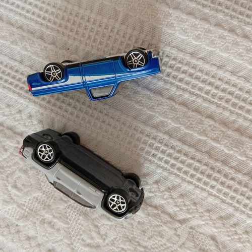 Hot Wheels Chevy Silverado and Chevrolet Silverado EV toy cars like new, pack of 2
