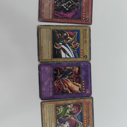 Yu-Gi-Oh! cards set with Flaming Swordsman, Battle Ox, Gearfried the Iron Knight, Three Sisters of Miss Harpy