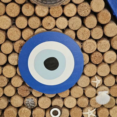 Sea-themed wall art with 600 corks and lighting
