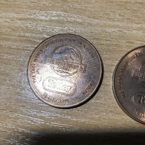 Jurassic World Tetley Velociraptor and Pteranodon coins, 38mm