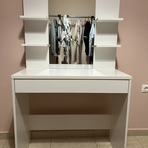 White makeup vanity table with drawer and shelves