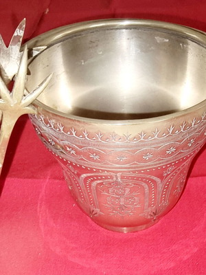 Silver-plated ice bucket like new with carved details and special handle