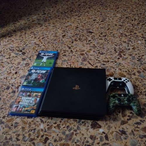 PS4 Pro console with 3 games and 2 controllers