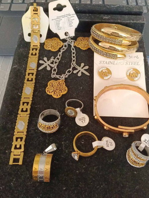 Jewelry set of 10 pieces: 4 rings, 4 bracelets, pendant, earrings
