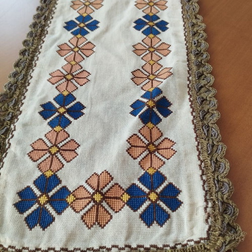 Vintage handmade embroidered table linens with cross-stitch and gold thread