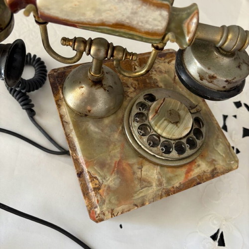 Antique rotary phone used with nephrite