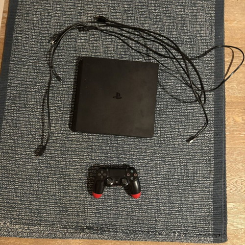 PlayStation 4 console with controller, disc reading issue