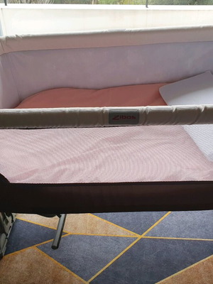 Next to me Zibos baby cot like new with wheels and carrying bag