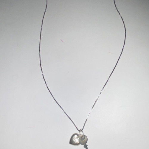 Silver necklace with heart and key used