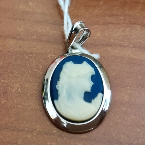 Cameo new with blue background and carved young woman figure
