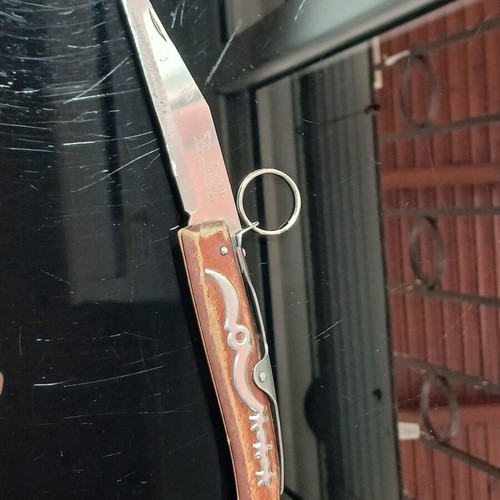 Okapi pocket knife used, carbon steel blade, wooden handle