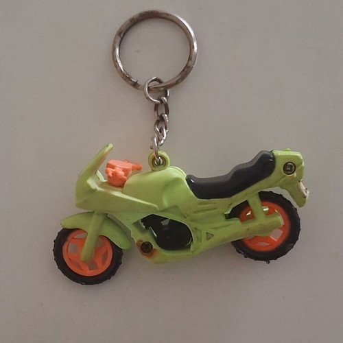 Vintage motorcycle and bicycle keychains used, colorful