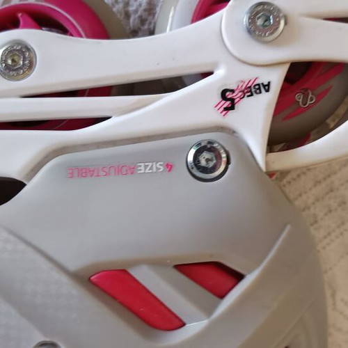 Roller skates used, size 33-36 with helmet and protective gear