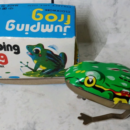 Tin wind-up frog in its box.