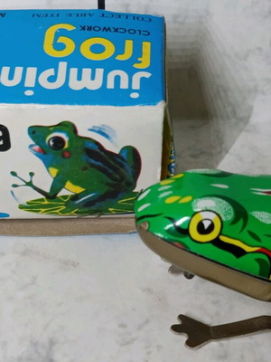 Tin wind-up frog in its box.