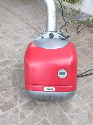 Ferroli Sun P7 burner used with auger and pellet tank