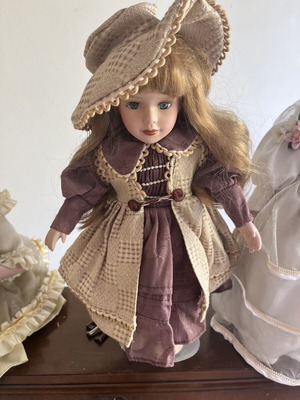 Porcelain doll with hat, 40 cm