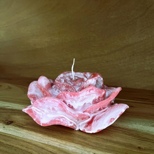 White and pink rose-shaped candle