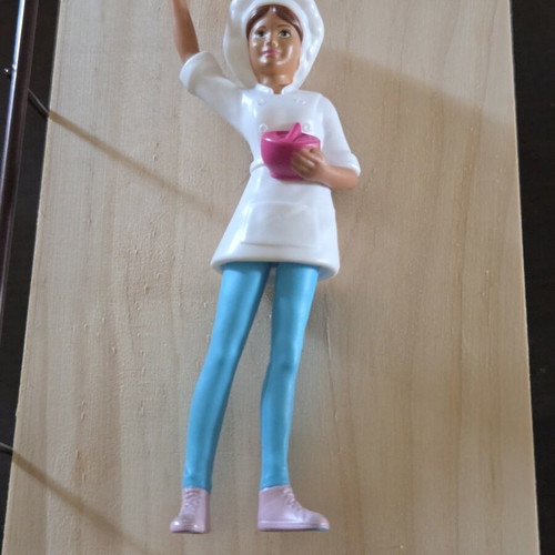 Female chef figure like new with brown ponytail