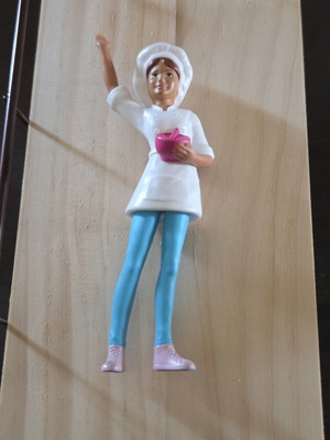 Female chef figure like new with brown ponytail