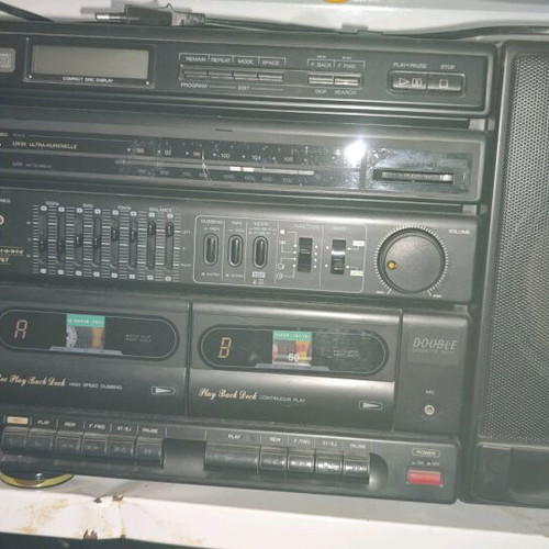 Booster stereo system used, 90s style, removable speakers