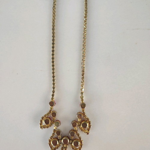 Antique necklace used with pink stones and gold rhinestones