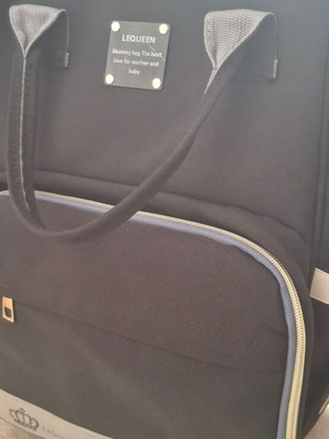 Lequeen Backpack Diaper Bag Black like new with changing mat and bottle warmer
