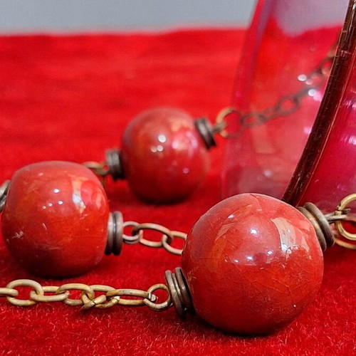 Hanging lamp used, blown red glass with ceramic balls and cross