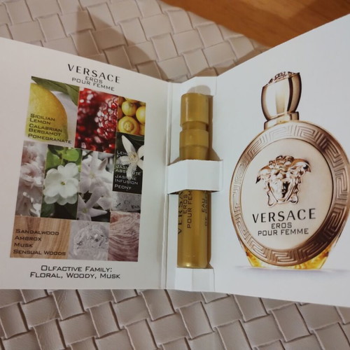Everyday beige toiletry bag with woven texture and Versace Eros Pour Femme perfume sample