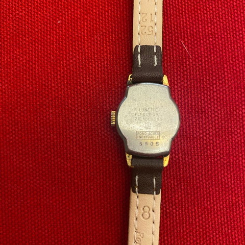 Wristwatch women's used, wind-up, metal, gold color, 1960s era
