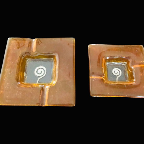 Ashtrays used, set of two square glass orange