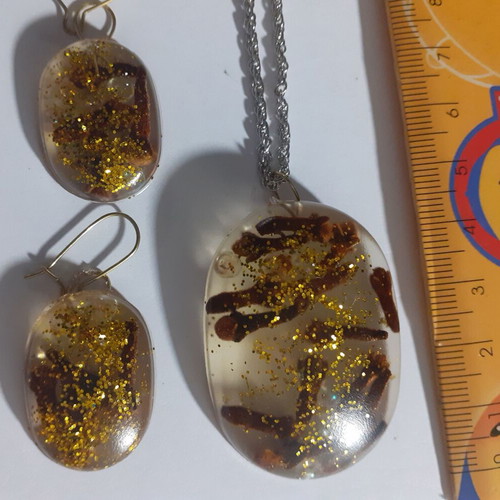 Set of 7 handmade pendant and earring jewelry sets with resin and dried herbs
